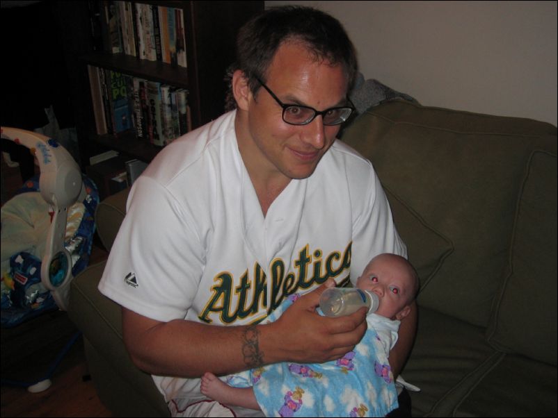 Uncle Gabe feeding Owen